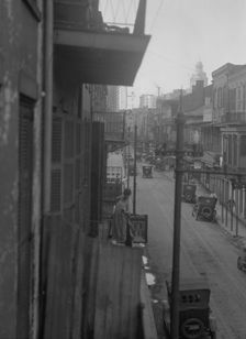 Street scene, New Orleans or Charleston, South Carolina, between 1920 and 1926. Creator: Arnold Genthe
