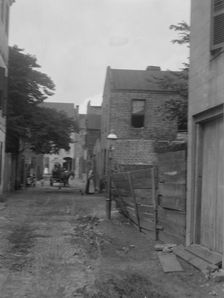 Street scene, New Orleans or Charleston, South Carolina, between 1920 and 1926. Creator: Arnold Genthe