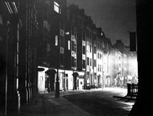 Street scene at night, Tottenham Court Road, Camden, London. Creator: Unknown