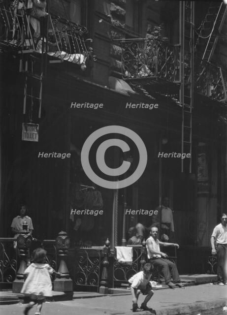 Street scene in an American city, between 1896 and 1942. Creator: Arnold Genthe.