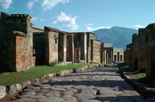Street scene in Pompeii with Vesuvius in the background, 1st century. Creator: Unknown