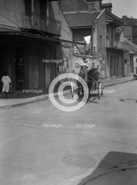 Street scene in the French Quarter, New Orleans, between 1920 and 1926. Creator: Arnold Genthe.
