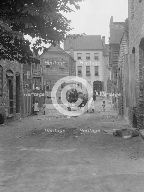 Street scene - looking north on Bedons Alley to Elliott Street; with horse and wagon..., c1920-1926. Creator: Arnold Genthe.