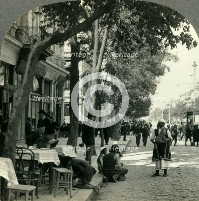 'Street Scene Showing Peasant Woman and Sidewalk Coffee-House, Sofia, Bulgaria', c1930s. Creator: Unknown.