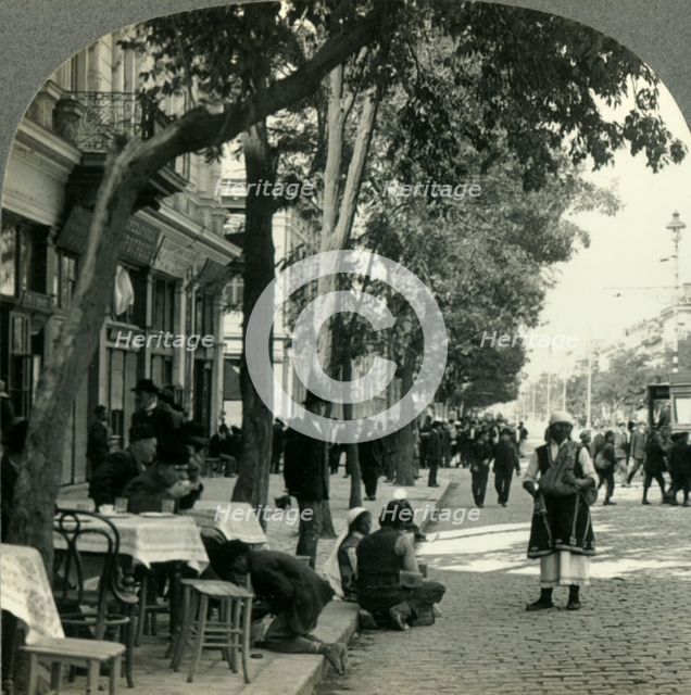 'Street Scene Showing Peasant Woman and Sidewalk Coffee-House, Sofia, Bulgaria', c1930s. Creator: Unknown.