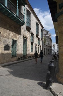 Street scene with couple in the distance, Havana, Cuba, 2024. Creator: Ethel Davies