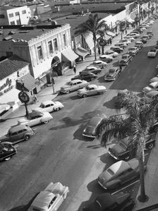 Street scene with cars parked, USA, c1952