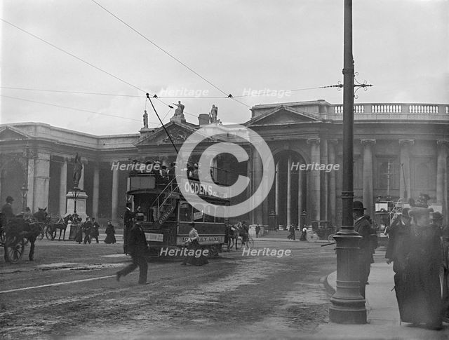 Street scene with electric tram in front of old Irish Paliament building, Dublin, Ireland, c1895. Creator: Robert Augustus Henry L'Estrange.
