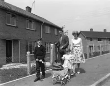 Street scene with family, Ollerton, North Nottinghamshire, 11th July 1962. Creator: Michael Walters