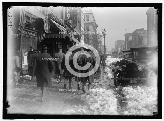 Street scene, with snow, Washington, D.C., between 1913 and 1918. Creator: Harris & Ewing.