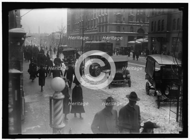 Street scene, with snow, Washington, D.C., between 1913 and 1918. Creator: Harris & Ewing.