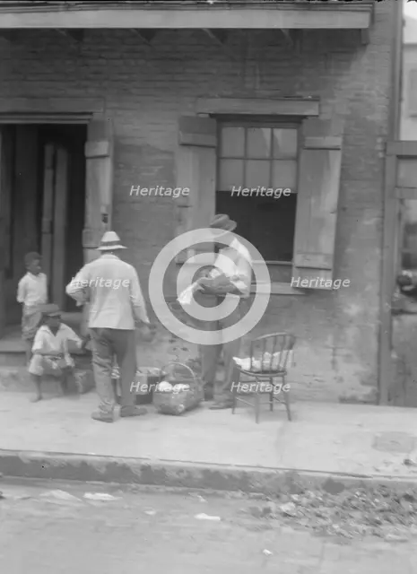Street vendor, New Orleans, between 1920 and 1926. Creator: Arnold Genthe.