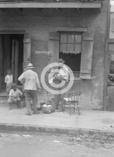 Street vendor, New Orleans, between 1920 and 1926. Creator: Arnold Genthe.