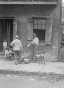Street vendor, New Orleans, between 1920 and 1926. Creator: Arnold Genthe