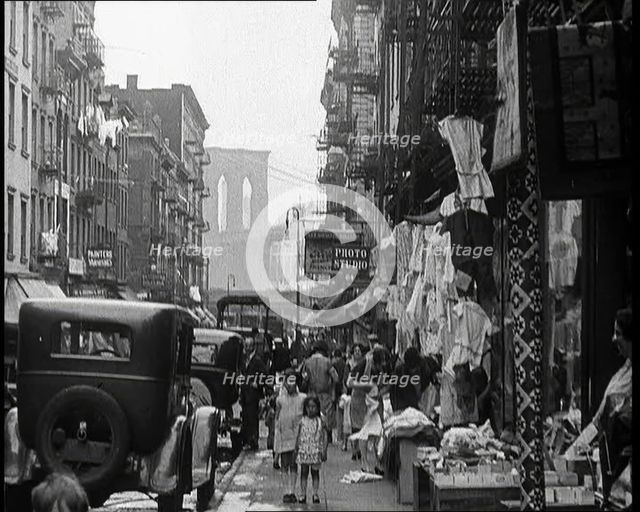 Street View of Street Market Selling Clothes in New York City, 1932. Creator: British Pathe Ltd.