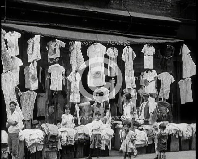 Street View of Street Market Selling Clothes in New York City, 1932. Creator: British Pathe Ltd.