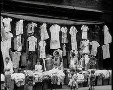 Street View of Street Market Selling Clothes in New York City, 1932. Creator: British Pathe Ltd