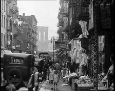 Street View of Street Market Selling Clothes in New York City, 1932. Creator: British Pathe Ltd