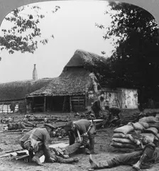 Stretcher bearers caring for wounded at an improvised first aid post, World War I, c1914-c1918. Artist: Realistic Travels Publishers