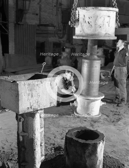 Stripping a steel casting, Wombwell Foundry, South Yorkshire, 1963.  Creator: Michael Walters.