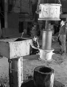Stripping a steel casting, Wombwell Foundry, South Yorkshire, 1963. Creator: Michael Walters