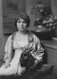 Sutro, Charles, Mrs., and dog, portrait photograph, 1913. Creator: Arnold Genthe