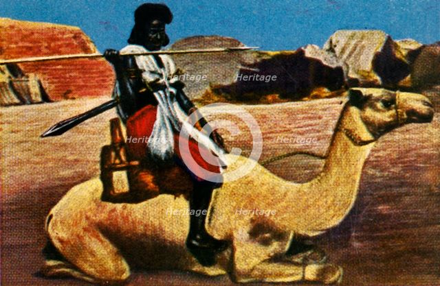 Sudanese warrior riding a camel, c1928. Creator: Unknown.