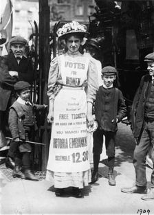 Suffragette advertising a march supporting votes for women, Strand, London, c1909