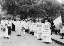 Suffragettes on a poster parade selling the Suffragette, 31st July, 1914