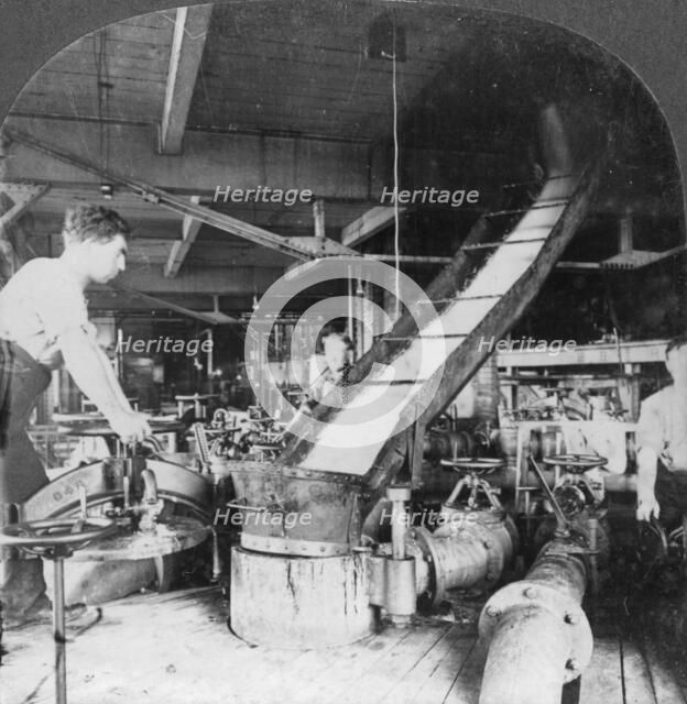 Sugar beet pulp and juice flowing from tank to tank, Montreal, Canada, early 20th century(?). Artist: Keystone View Company