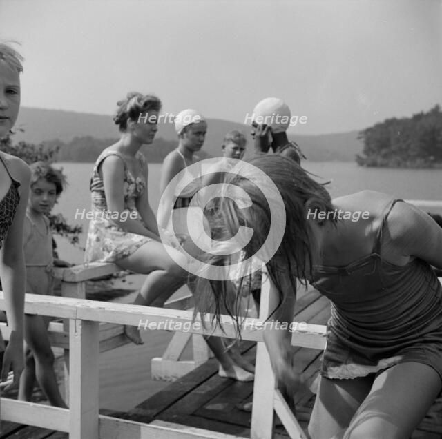Sun bathing on Lake Tiorati, Camp Christmas Seals, Haverstraw, New York, 1943. Creator: Gordon Parks.