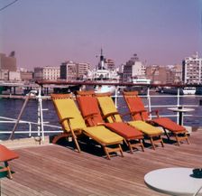 Sun loungers on the deck of a ship at the port of Piraeus, Athens, Greece, c1955. Creator: Arthur Charles Kirby Ware