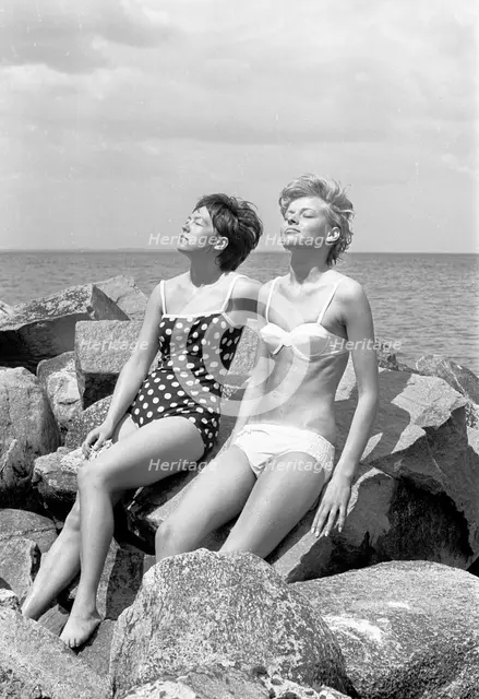 Sunbathing by the Oresund, Bostahusen, Landskrona, Sweden, 1965. Creator: Unknown.