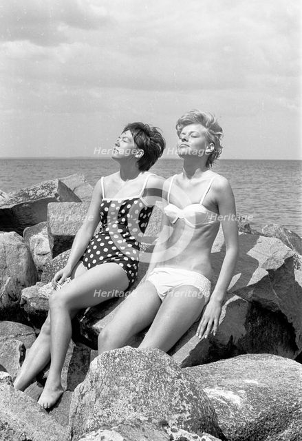 Sunbathing by the Oresund, Bostahusen, Landskrona, Sweden, 1965. Creator: Unknown.