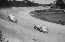 Sunbeam of EL Bouts and Vauhall 30/98 of RJ Munday, BARC meeting, Brooklands, 16 May 1932. Artist: Bill Brunell