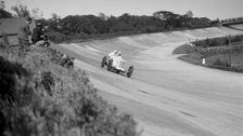 Sunbeam of EL Bouts on the banking, BARC meeting, Brooklands, 16 May 1932. Artist: Bill Brunell