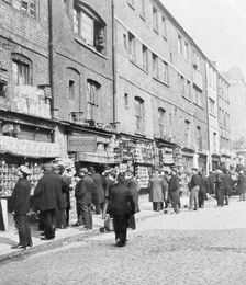 Sunday bird fair, Sclater Street, off Brick Lane, London, c1900. Creator: John Galt