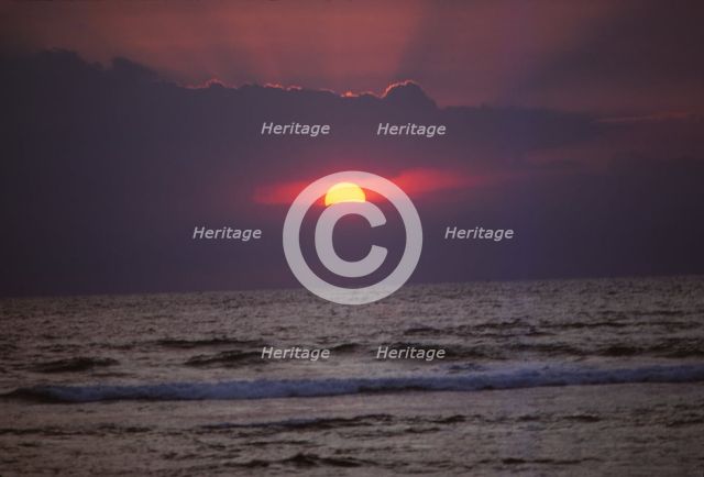 Sunset over Indian Ocean in Hikkaduwa, Sri Lanka, 20th century. Artist: CM Dixon.
