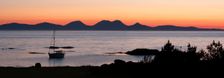 Sunset over Jura seen from Kintyre, Argyll and Bute, Scotland. Creator: Peter Thompson