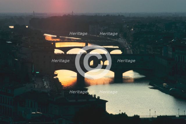Sunset over the Arno, Florence, Italy. Creator: Peter Thompson.