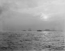 Sunset off the Battery, New York harbor, ca 1900. Creator: Unknown