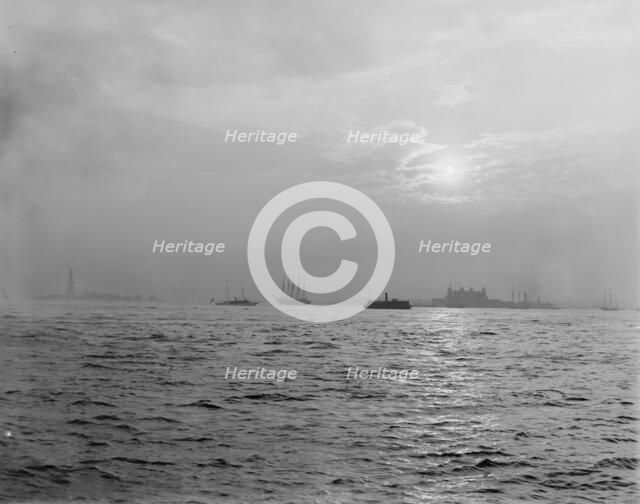 Sunset off the Battery, New York harbor, ca 1900. Creator: Unknown.