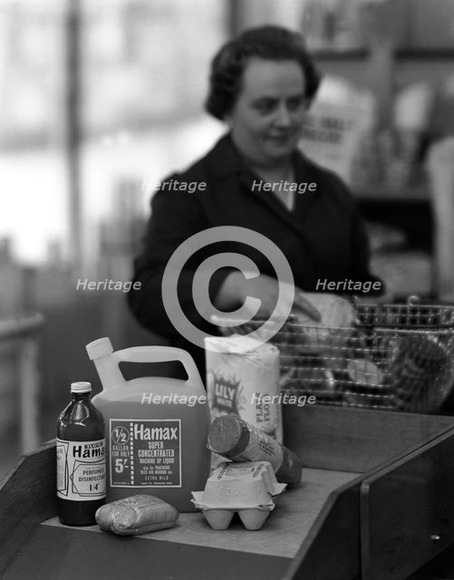 Supermarket checkout, Mexborough, South Yorkshire, 1966. Creator: Michael Walters.
