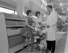 Supermarket shoppers and salesman, Co-op, Barnsley, South Yorkshire, 1961. Creator: Michael Walters