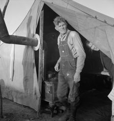 Supper time in FSA migratory emergency camp...the pea fields, Calipatria, CA, 1939. Creator: Dorothea Lange