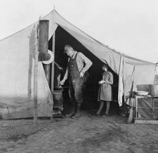 Supper time in FSA migratory emergency camp...in the pea fields, Calipatria, California, 1939. Creator: Dorothea Lange