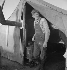 Supper time in FSA migratory emergency camp...the pea fields, Calipatria, CA, 1939. Creator: Dorothea Lange