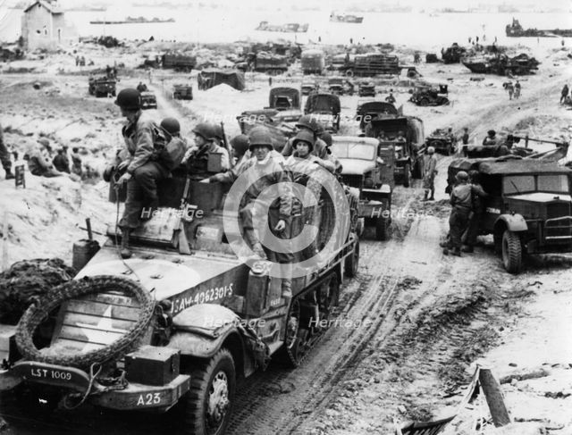 Supplies and troops move inland, Normandy beaches, France, 6 June 1944. Creator: Unknown.