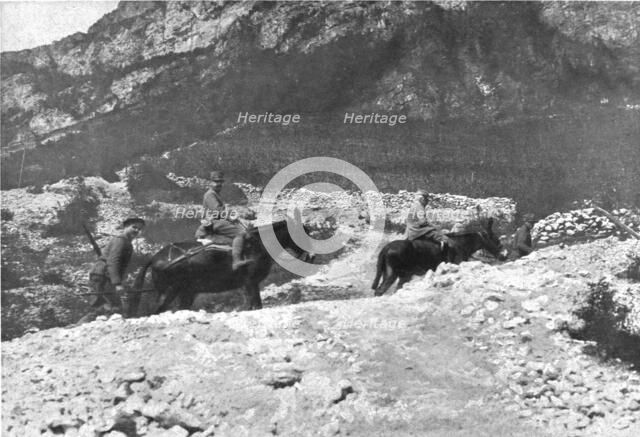 'Sur le front Italien, apres Gorizia ; Le general Cadorna, a dos de mulet et suivi d'un officier d'o Creator: Unknown.