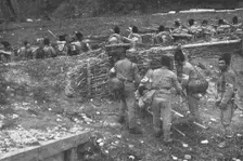 Sur le front Roumain; brancardiers emportant un blesse 1916. Creator: Unknown